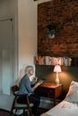 Man in Black Long Sleeve Shirt Sitting on Chair