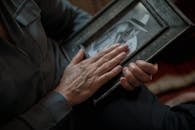 Close-Up Shot of a Person Holding a Picture Frame