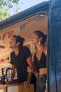 Man in Black Crew Neck T-shirt Standing Beside Woman in Black Tank Top