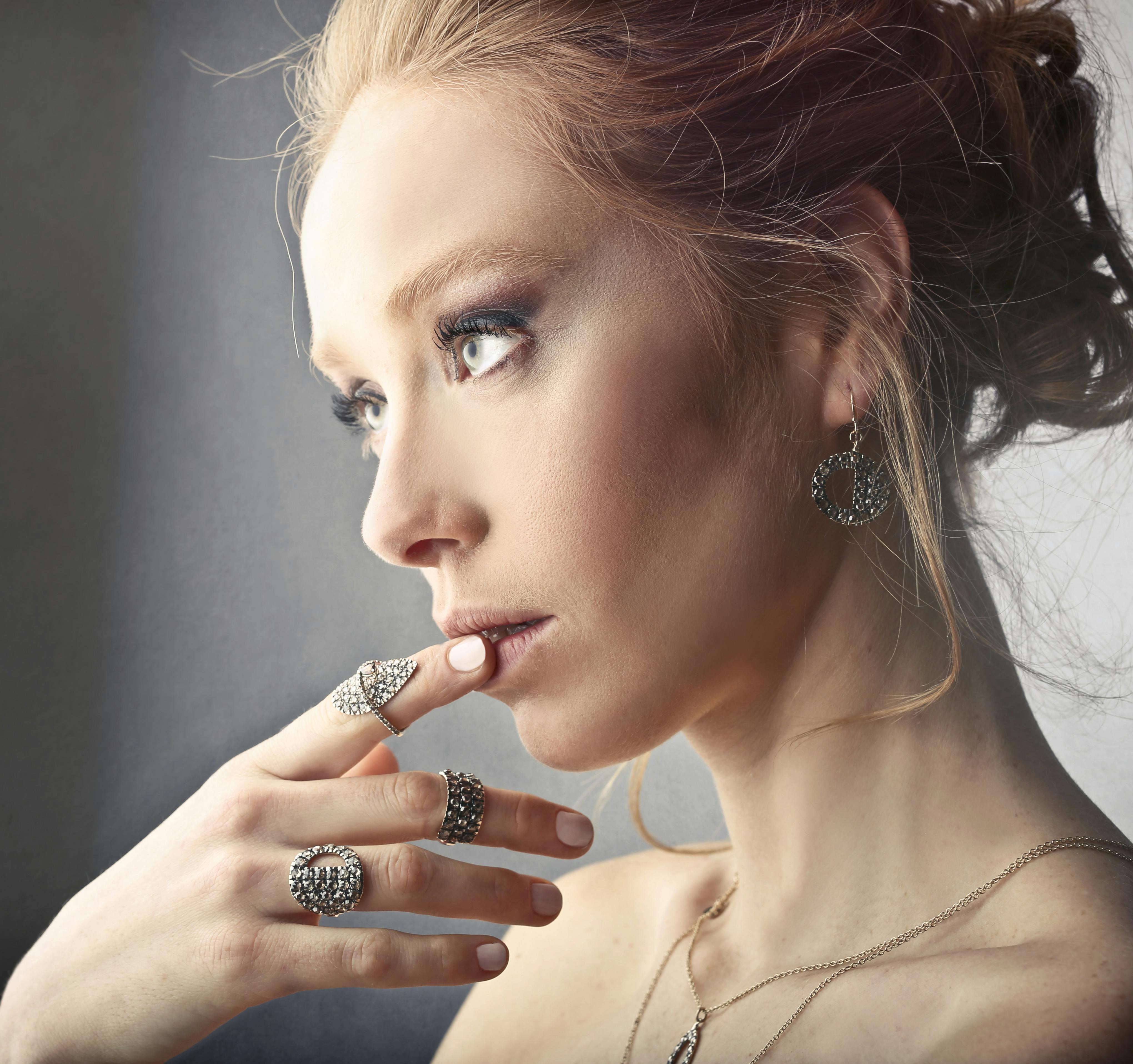 Woman Wearing Rings and Earrings · Free Stock Photo