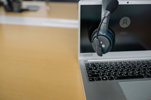 Close Up Photo of Headset on a Laptop