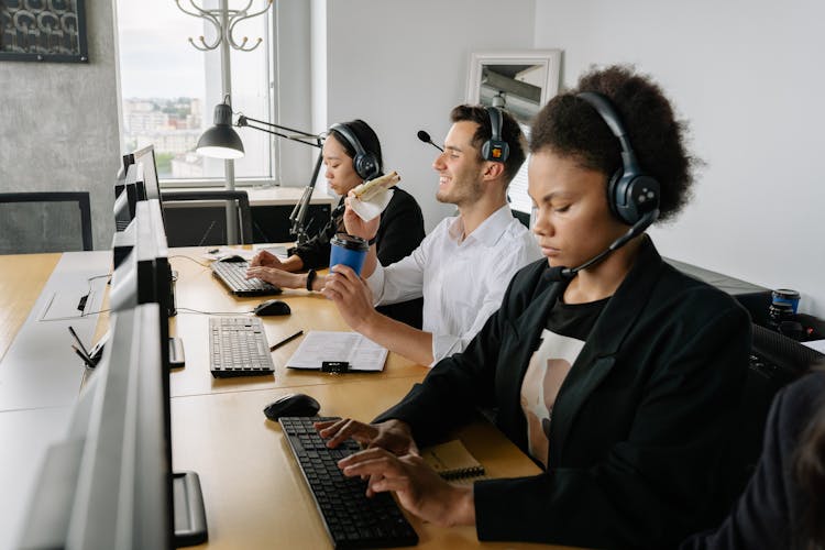 Three People Working In The Office
