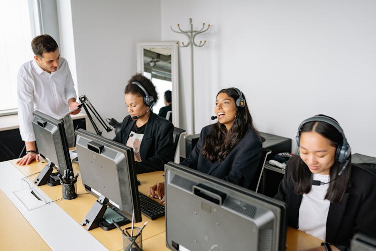 A Man Checking His Employees While Working
