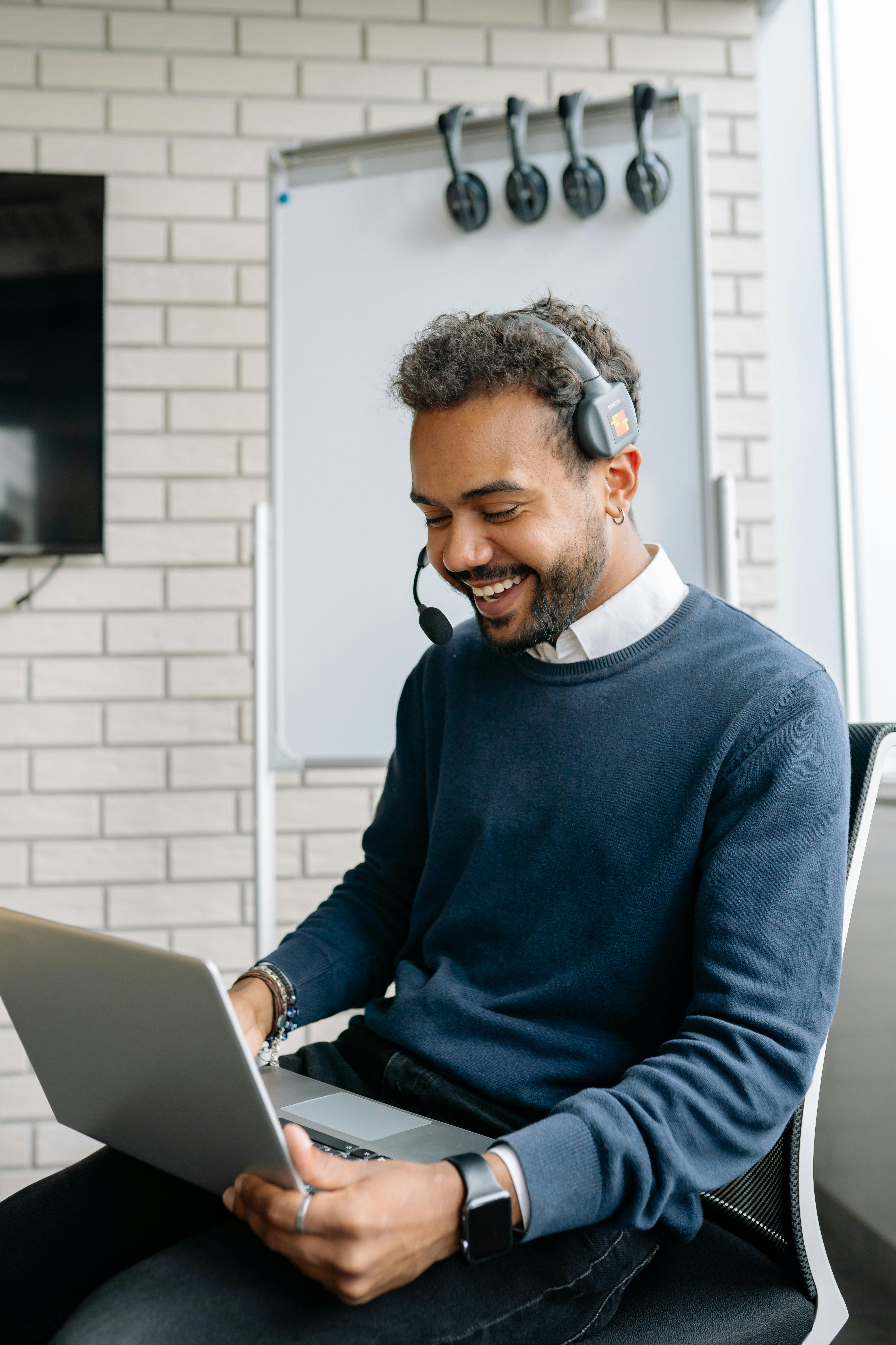 Customer support representative with headset and laptop
