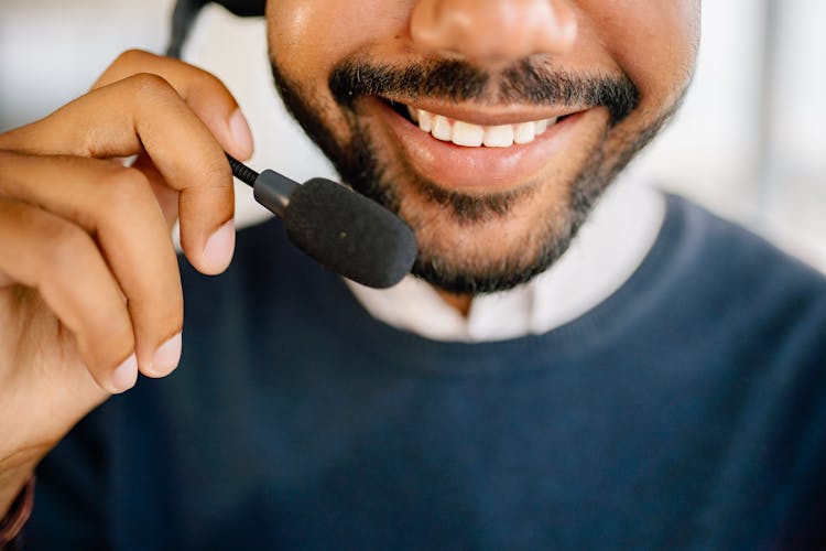 Man In Black Crew Neck Shirt Holding Headset Microphone