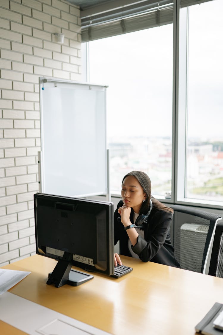 A Woman Staring At Her Computer Screen