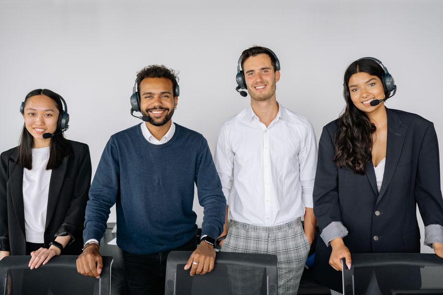 Support agent with a headset at a workstation — photo by Yan Krukau on Pexels