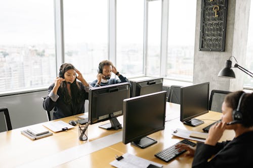 Free Call Center Agents Working at an Office Stock Photo