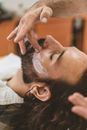 Person Applying Shaving Cream On A Man With Facial Hair
