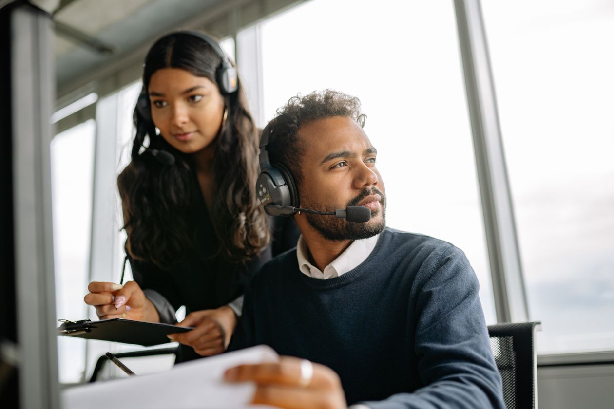 Professionals working with headsets