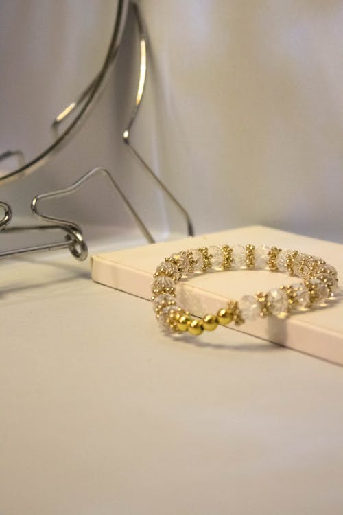 Free Close-up Photo of Gold Beaded Bracelet Stock Photo