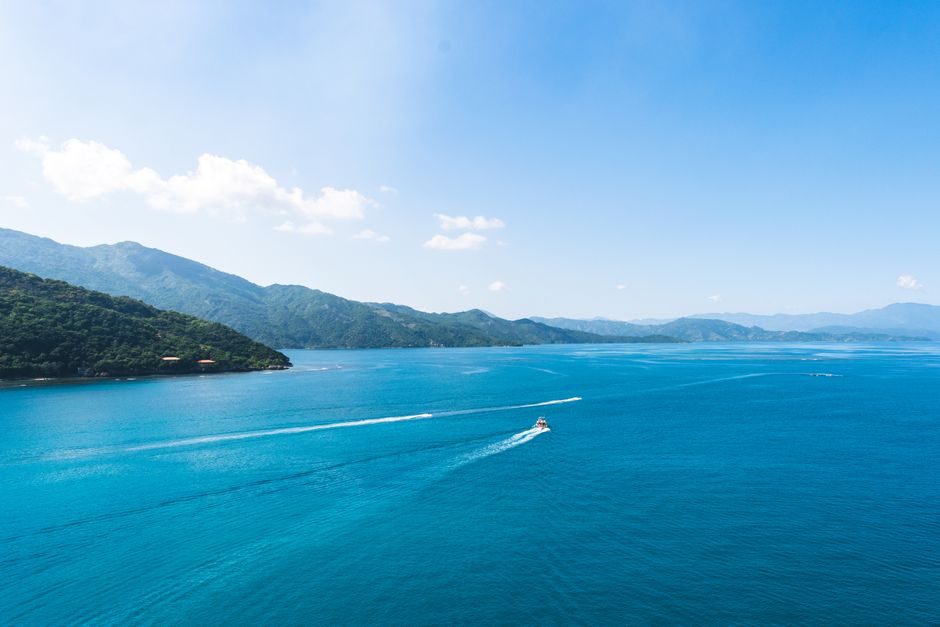 Aerial view of the azure Caribbean Sea and lush coastline of Labadie, Haiti.