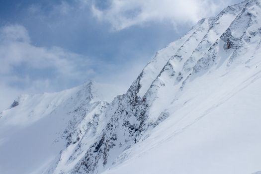 Snow Covered Mountain Under Blue Sky
