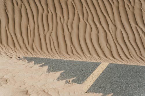 Brown Sand on Gray Concrete Floor