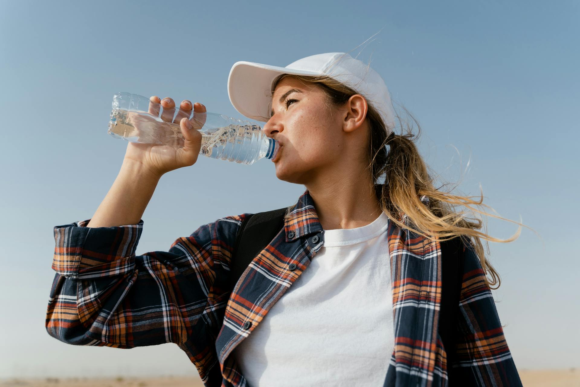 Woman Drinking From Water Bottle