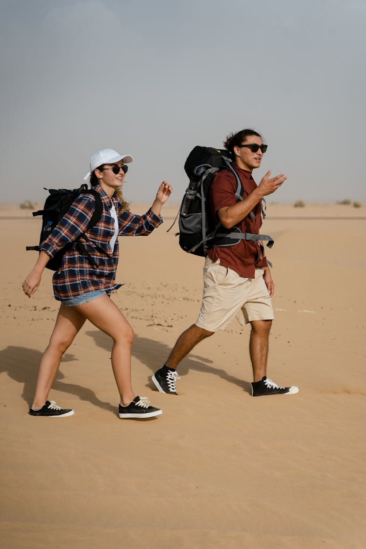 A Couple Exploring A Desert Together