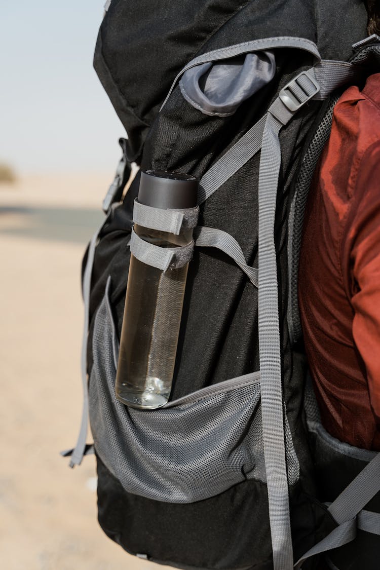 Black And Gray Backpack With Water Tumbler Hanging 