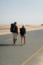 Man and Woman Walking on the Road