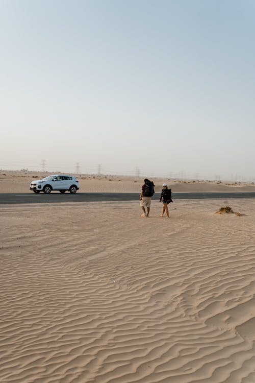 People Walking towards their Car