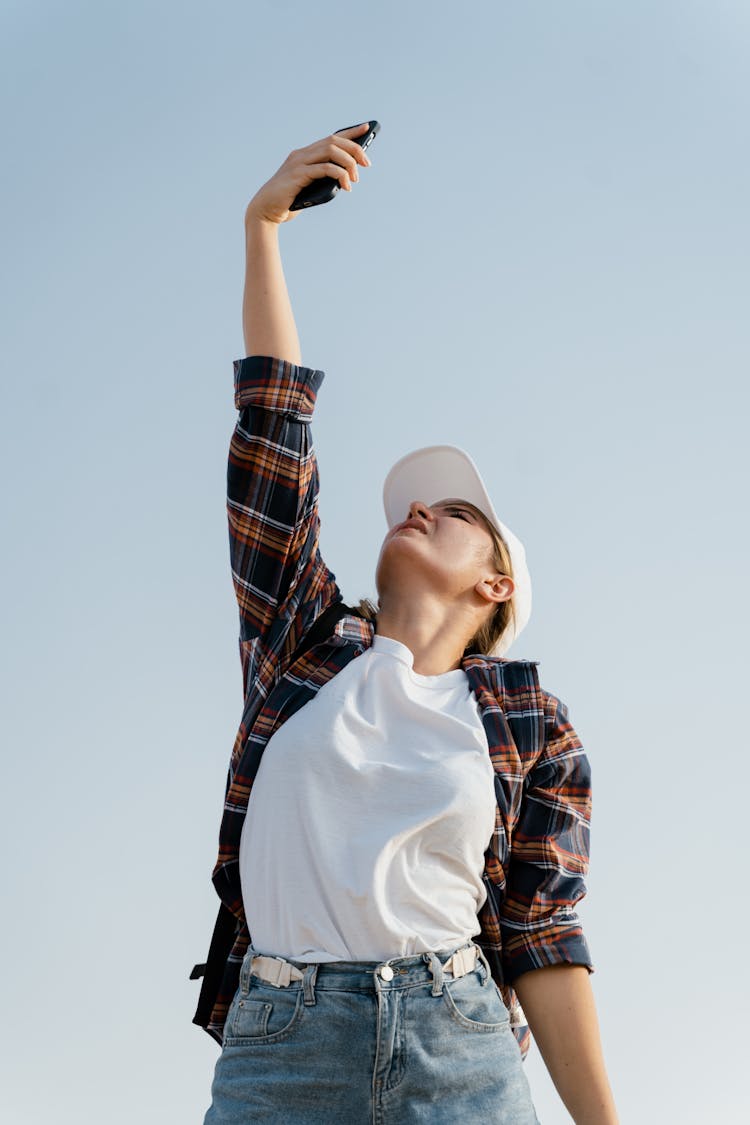 A Woman Searching For Phone Signal