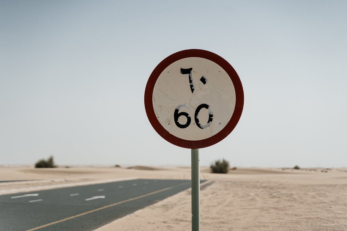 Free A Road Sign on the Desert Stock Photo