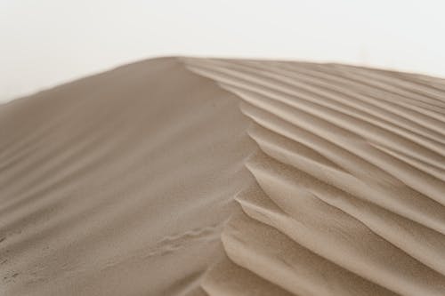 Photo of Sand Dunes in a Desert