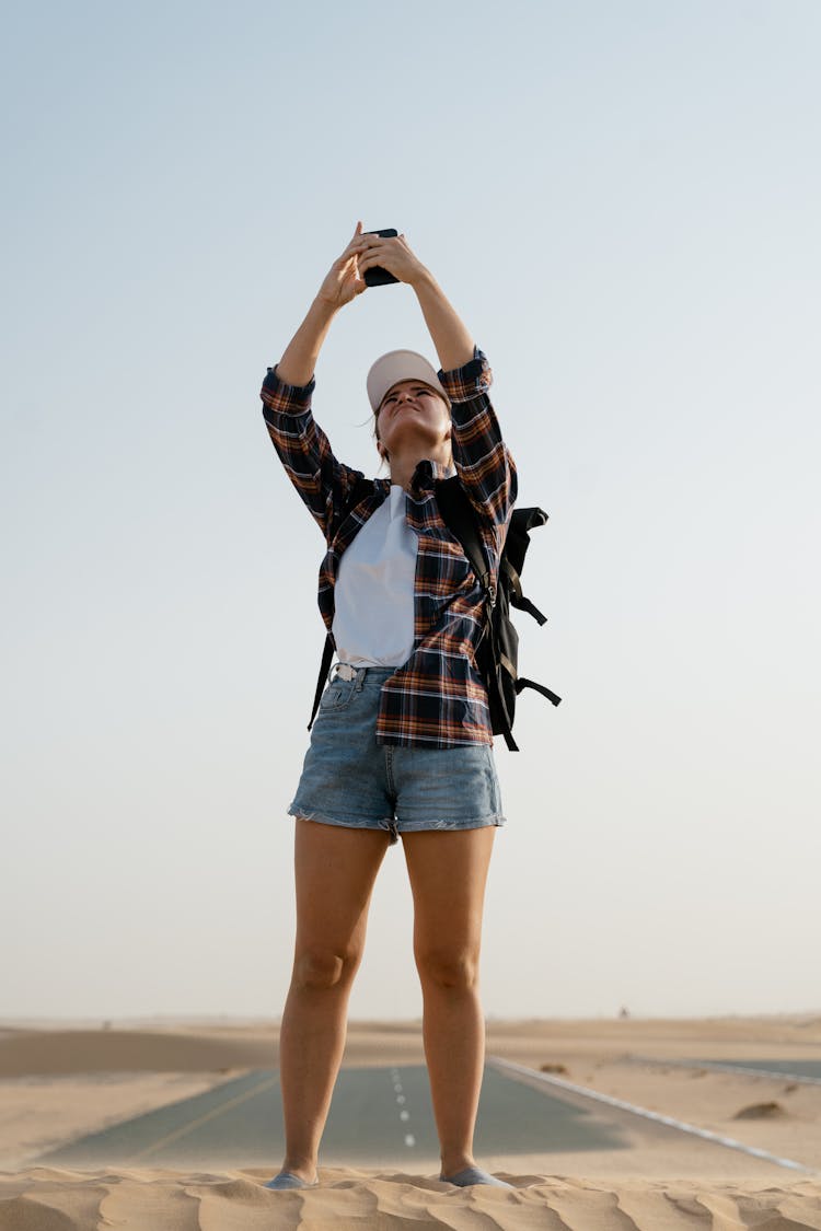 Woman Finding Signal In The Road