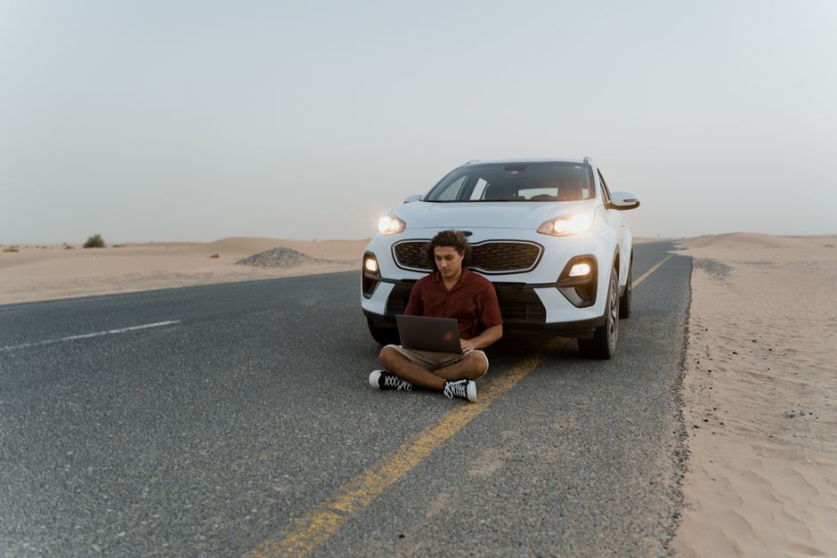 International Driving Permit alongside a passport and UAE visa stamp