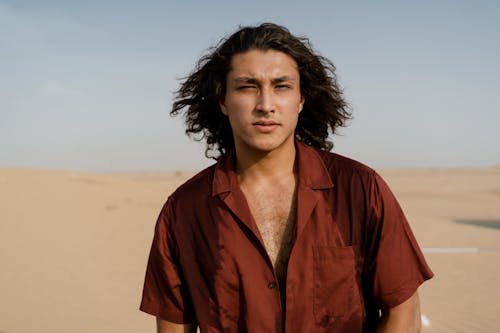 Man Wearing Red Polo at the Desert