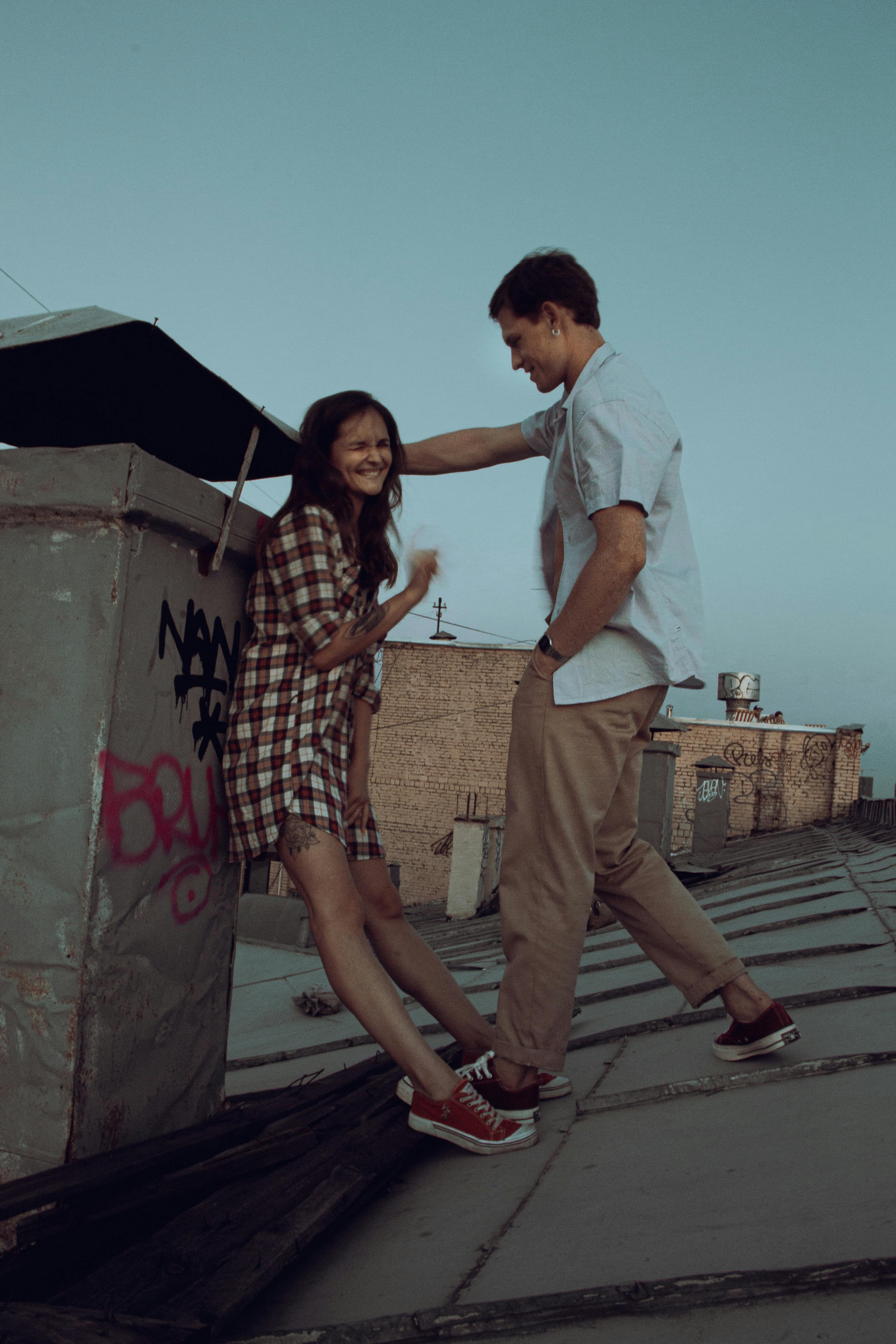 Man with a Woman in the Roof · Free Stock Photo