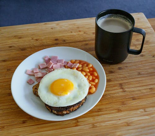 Free Fried Egg and Sliced Ham on White Ceramic Plate  Stock Photo