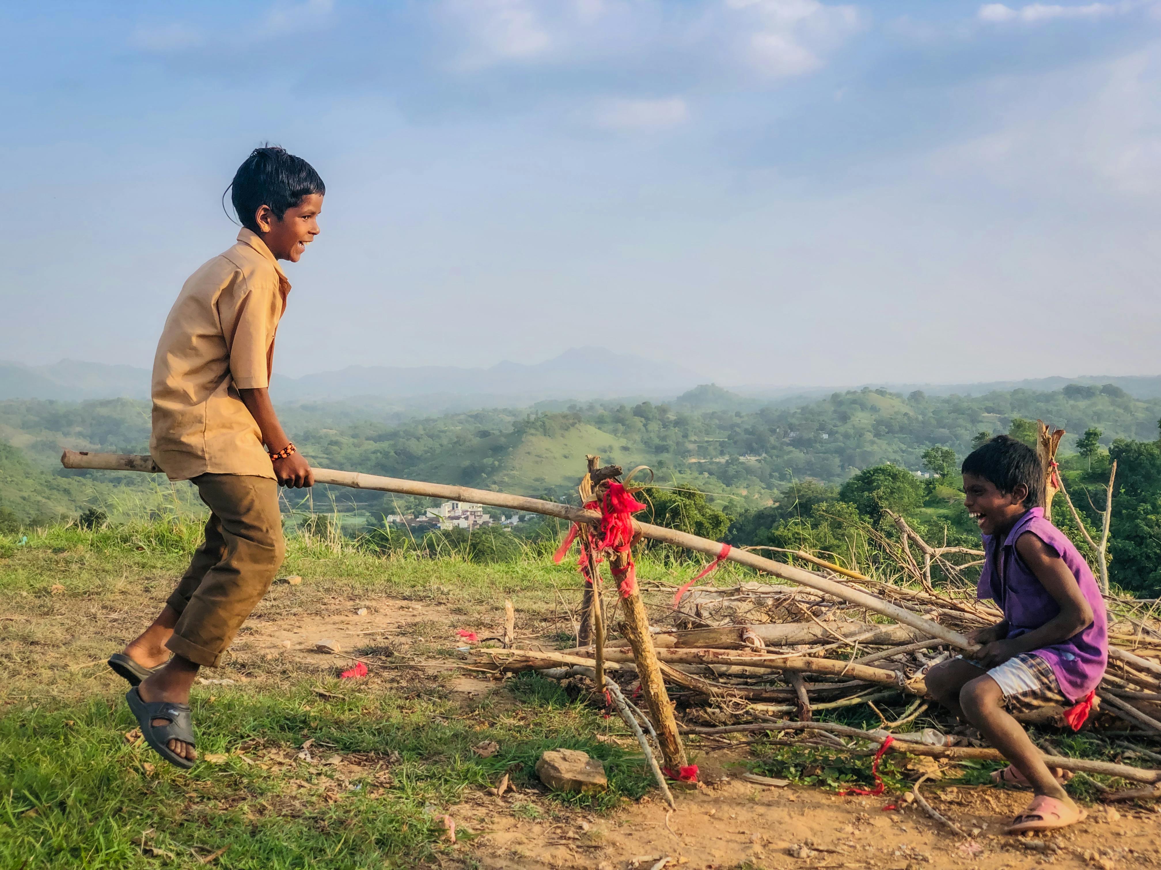 Two Happy Kids Playing Seesaw · Free Stock Photo