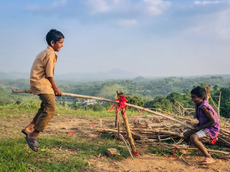 Two Happy Kids Playing Seesaw