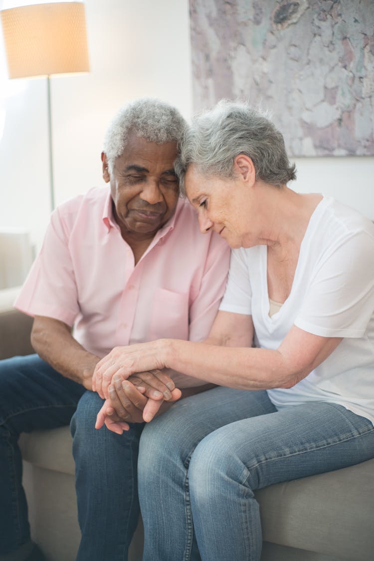 Elderly People Comforting Each Other