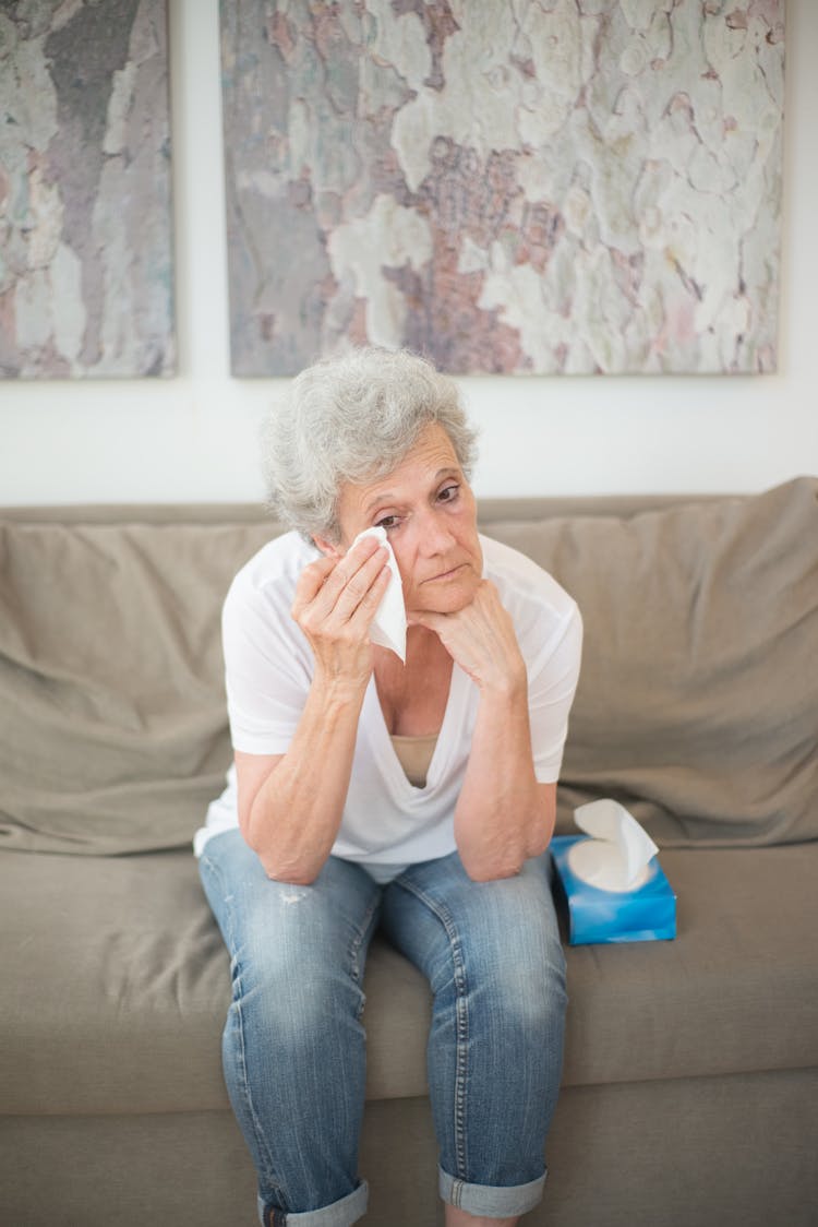 An Elderly Woman Wiping Her Tears