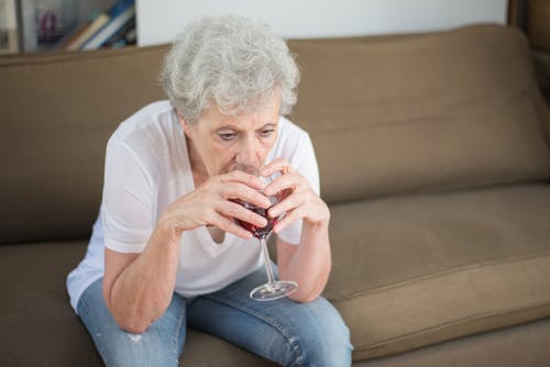 Elderly Woman Drinking Wine