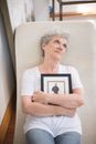 Man in White Crew Neck T-shirt Holding Picture Frame