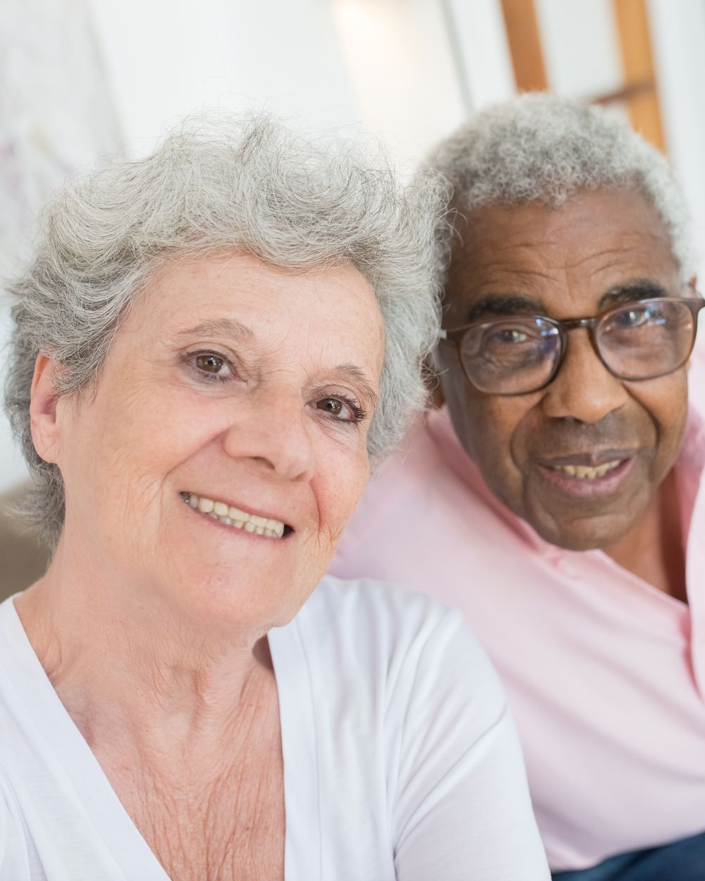 Smiling older couple relaxing together at home
