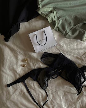 Stylish display of luxury lingerie and accessories including earrings in an elegant setting.