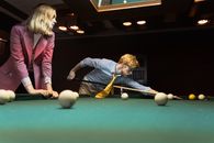 Woman in Blue Long Sleeve Shirt and Black Pants Playing Billiard