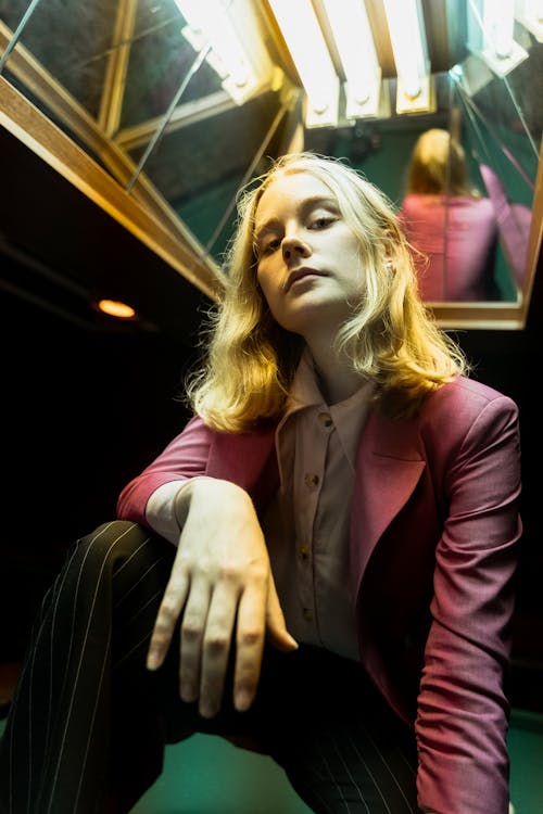 Low-Angle Shot of a Woman in a Purple Blazer