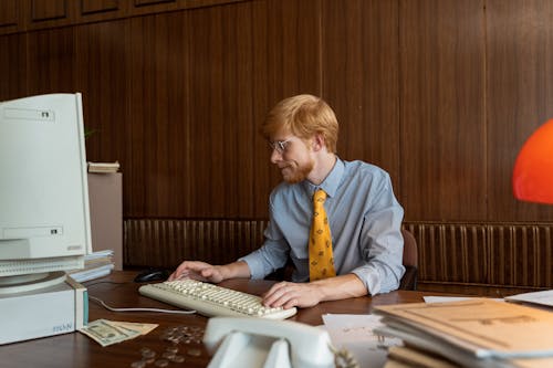 A Businessman Working at His Computer
