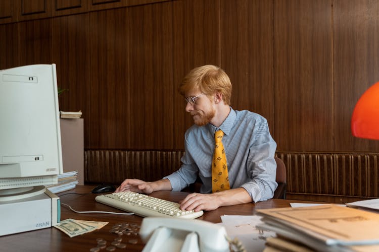 A Businessman Working At His Computer