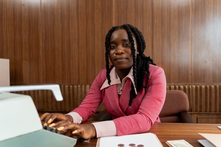 A Woman Using Typewriter