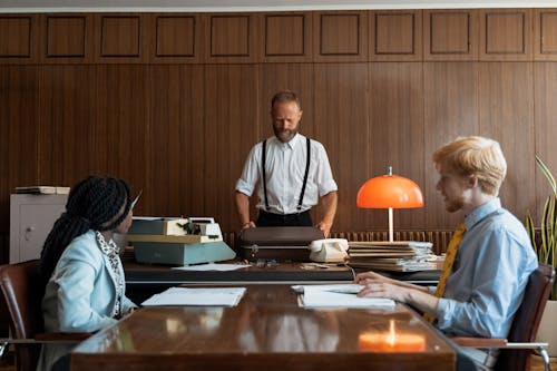 Free A Boss Opening a Briefcase while in a Business Meeting Stock Photo