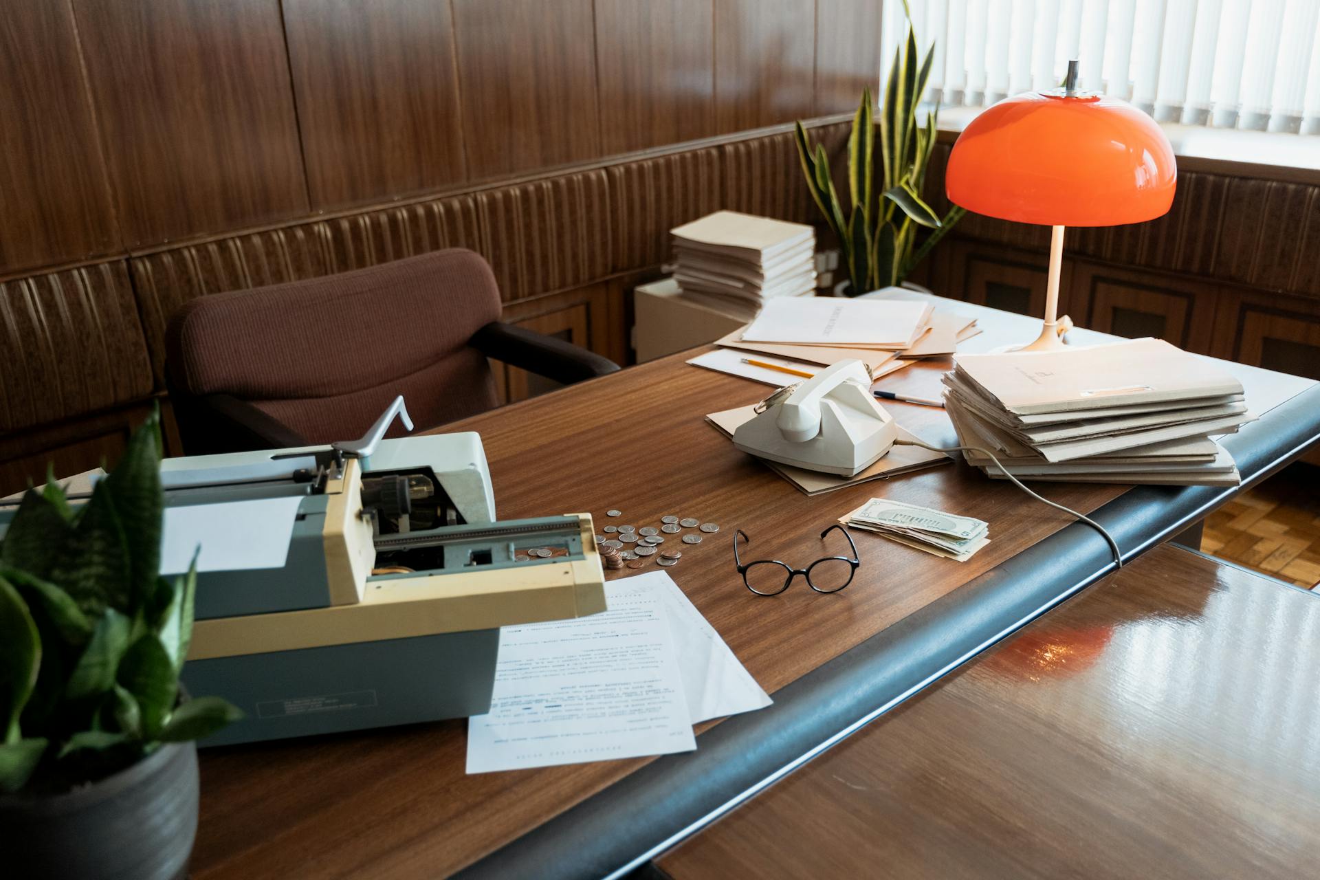 Photo of a Desk with a Typewriter and Documents