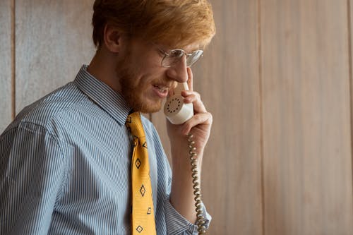 A Bearded Man on a Phone Call