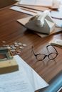 Black Framed Eyeglasses on a Wooden Desk