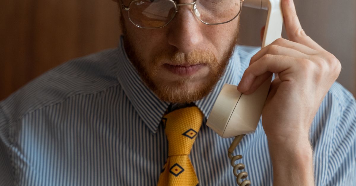 Telecom Guy Using Phone A Man using a Telephone · Free Stock Photo