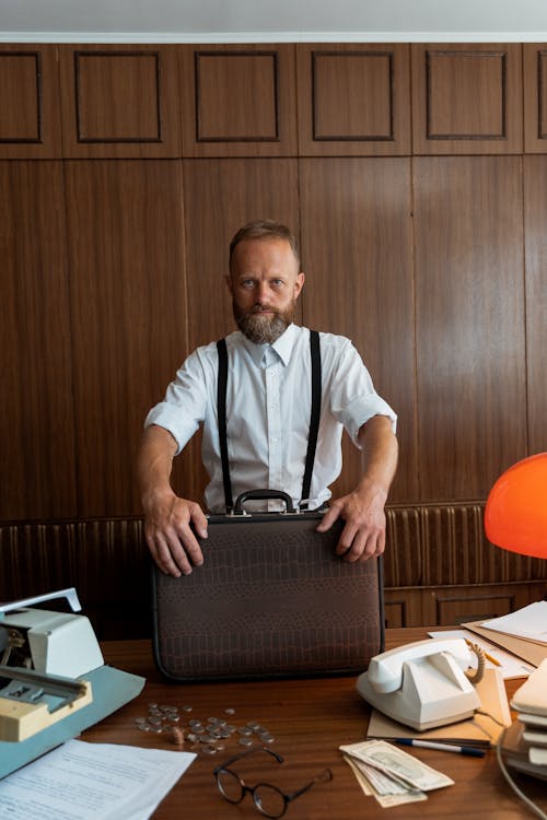 A Businessman Holding a Brown Briefcase